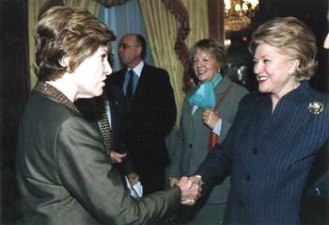 Barbara Taylor Bradford greets First Lady, Laura Bush, guest-of-honor at a luncheon given by the Police Athletic League (PAL), a charity for children. December 2003 in New York City